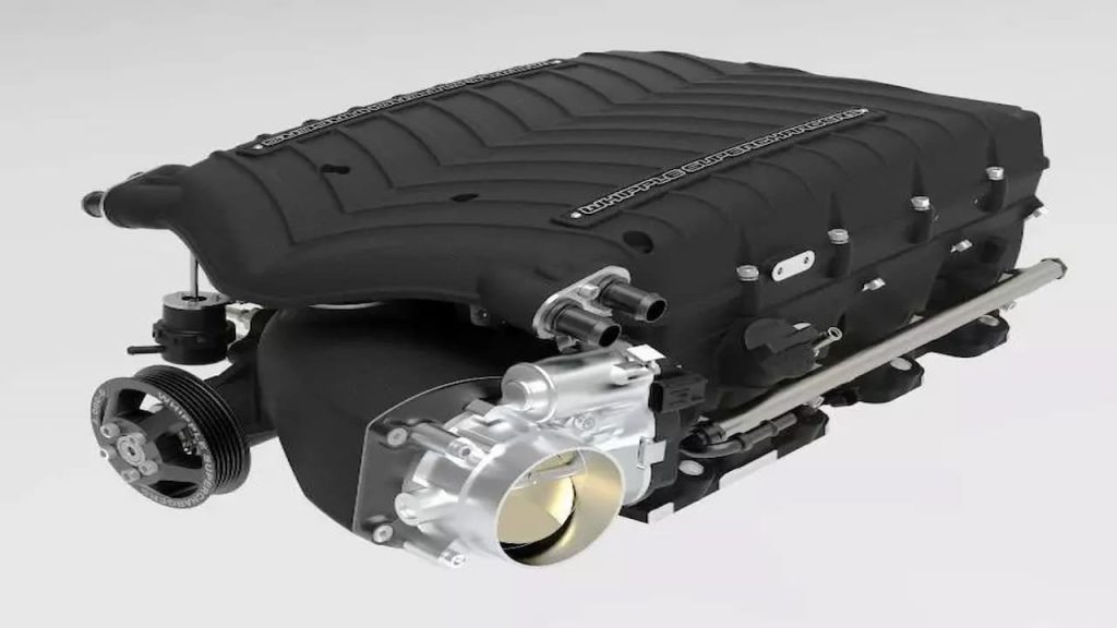 Black Whipple Gen 6 Supercharger assembly with ribbed housing, silver throttle body, pulley system, and various mounting brackets on white background